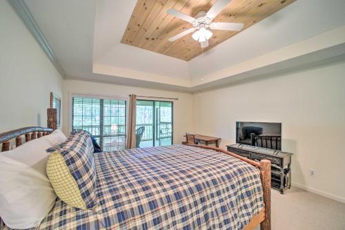 a bedroom with a bed and a ceiling fan at Scenic Sapphire Condo with Deck and Gas Grill! in Sapphire