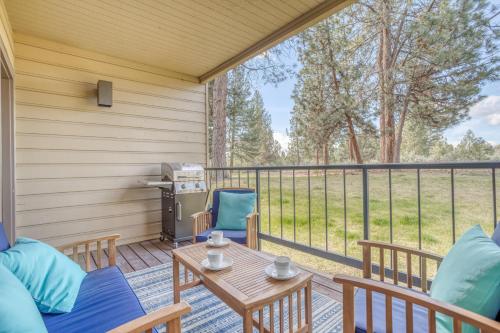 a screened in porch with a table and chairs at Ski House 154 - Meredith Lodging in Bend
