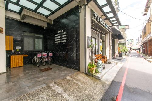 a store with bikes parked on the side of a building at Jinguann B&B in Hualien City
