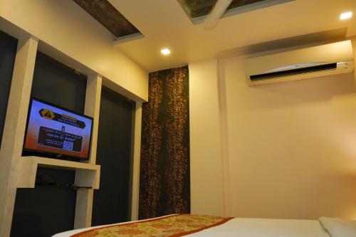 Ένα ή περισσότερα κρεβάτια σε δωμάτιο στο Hotel Spices Navi Mumbai