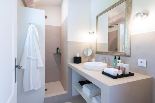 a bathroom with a sink and a mirror at Terre d'Orizon in Tourrettes-sur-Loup