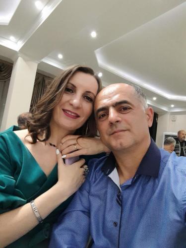 a woman is standing next to a man at My home udabno in Udabno