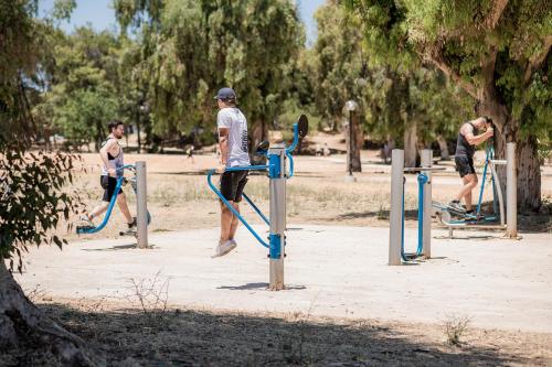a group of young men playing in a park at Mossa Well Being Hotel - Heated pool in Kato Daratso