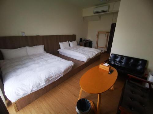 Ένα ή περισσότερα κρεβάτια σε δωμάτιο στο 360 Coffee Homestay