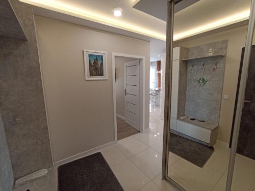 Kúpeľňa v ubytovaní APARTAMENTY BARSKA 69