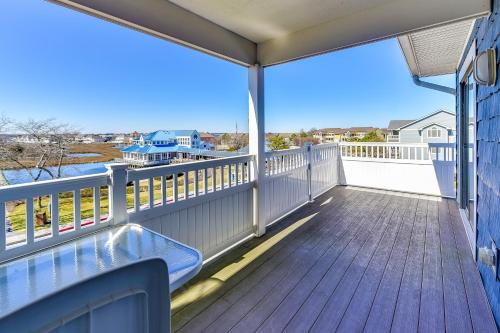 a balcony with a blue bench on a wooden deck at Harbour Club 12G in Ocean City