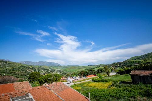 a view of a town with mountains in the background at Bianca Casa in Bolognetta