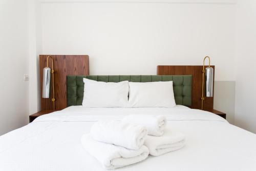 Llit o llits en una habitació de Suggrou Terrace apartment #8