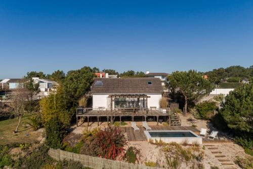 an aerial view of a house with a deck at Precious Cabin in Comporta in Comporta