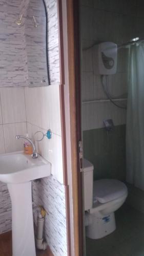 a bathroom with a sink and a toilet at Tatev 1 in Tatʼev