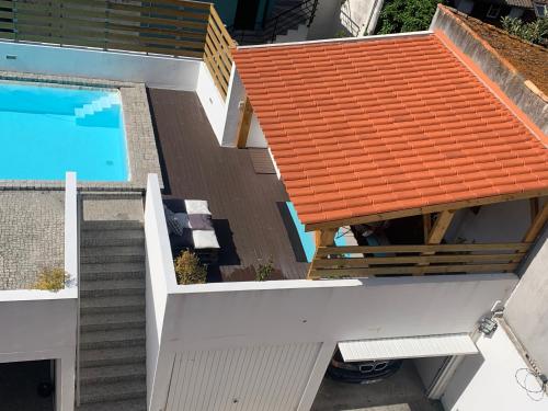 an overhead view of a building with a swimming pool at Casa dos Carvalhos in Coimbra