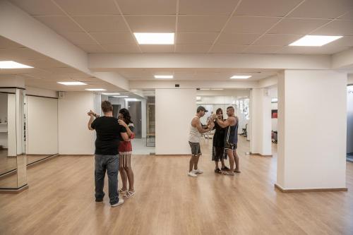 a group of people standing in a room at Mossa Well Being Hotel - Heated pool in Kato Daratso