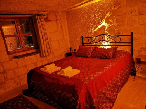 Кровать или кровати в номере CAPPADOCİA ST.NİNO'S GARDEN