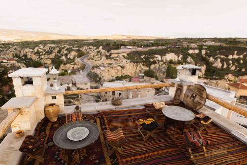 a view from the top of a building with tables and chairs at Solo Cave Suites in Nevsehir
