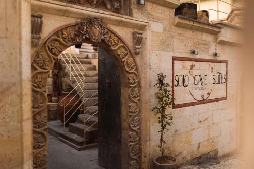 an entrance to a wine cellar with a wooden door at Solo Cave Suites in Nevsehir