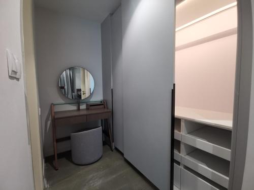 a bedroom with a vanity and a mirror and a desk at The Ooak Suites and Residence@ Kiara 163 in Kuala Lumpur