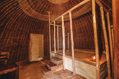 an inside of a room with a large cage at Sextantio Rwanda, The Capanne (Huts) Project in Kamembe