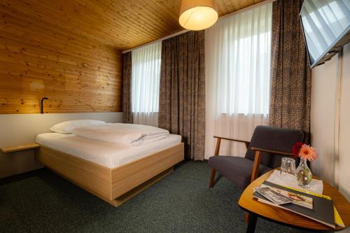 Grüner Baum Wachau - Retro Frühstückspension tesisinde bir odada yatak veya yataklar