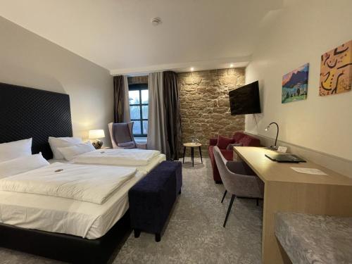 Postel nebo postele na pokoji v ubytování Hotel Bachmühle