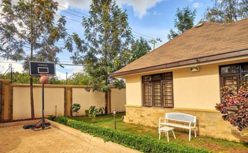 a basketball hoop in front of a house at The Cottage Residence Karen in Nairobi