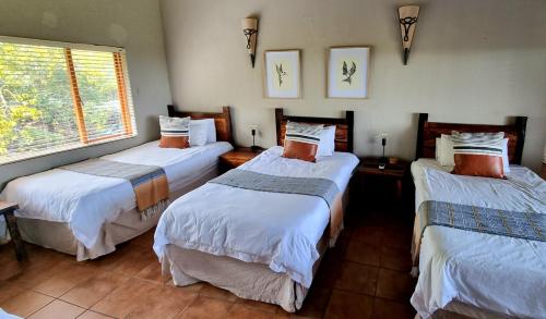 Postel nebo postele na pokoji v ubytování Boabab Lodge