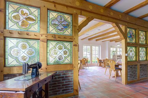 a kitchen with stained glass windows in a house at Landhaus Schwerin in Schwerin