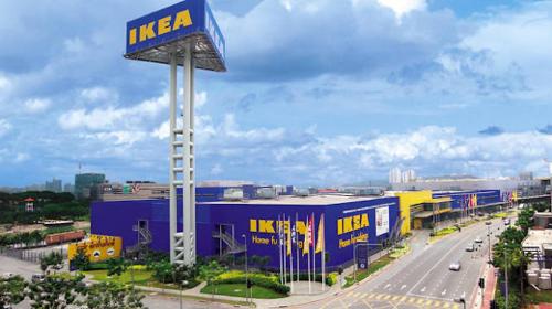 a large blue and yellow building with a sign on it at UNA Sunway Velocity Kuala Lumpur by Unimax in Kuala Lumpur