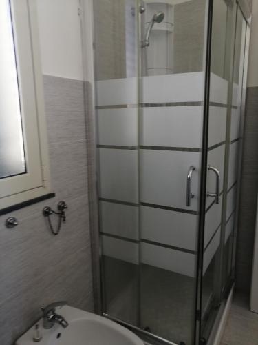 a bathroom with a shower and a sink at CM HOUSE MARZAMEMI in Marzamemi