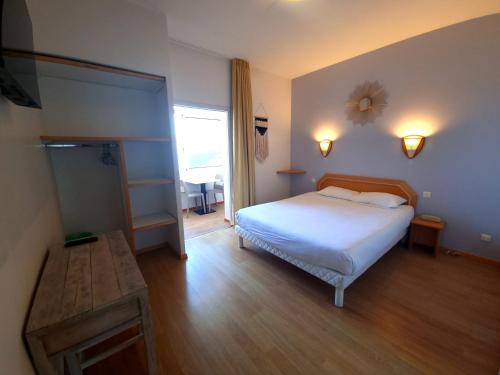 Postel nebo postele na pokoji v ubytování Hôtel Sole Mare