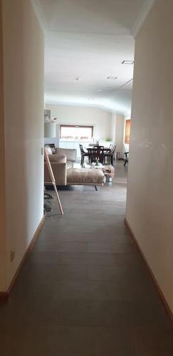 a hallway leading to a living room with a couch at Casa restaurante O Pitès in Alfaião
