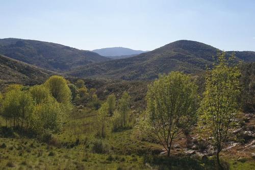 a view of a valley with mountains in the background at Casa restaurante O Pitès in Alfaião