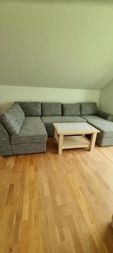 a living room with a couch and a coffee table at Juuli apartament in Kuressaare