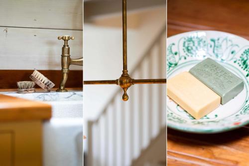 a table with a plate with a book and a lamp at Secret Cottage in St Ives