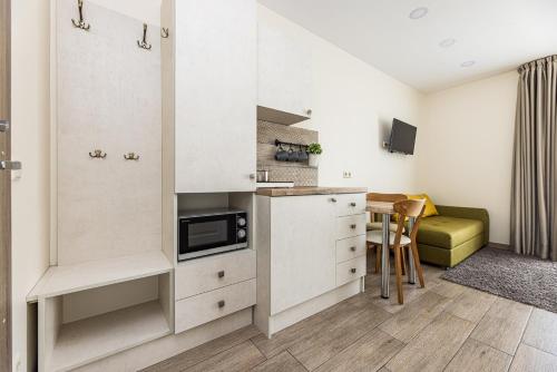 Virtuvė arba virtuvėlė apgyvendinimo įstaigoje Amber drop