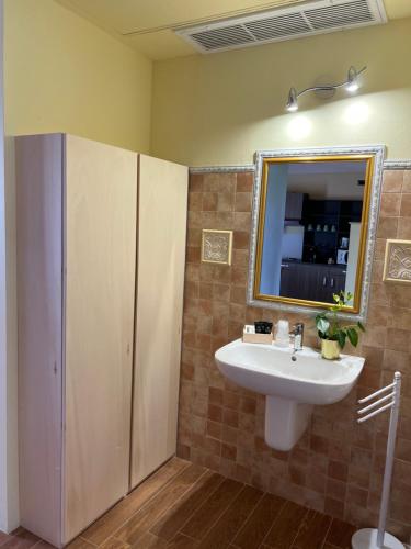 a bathroom with a sink and a mirror at Residence Ulivi in Cavaion Veronese