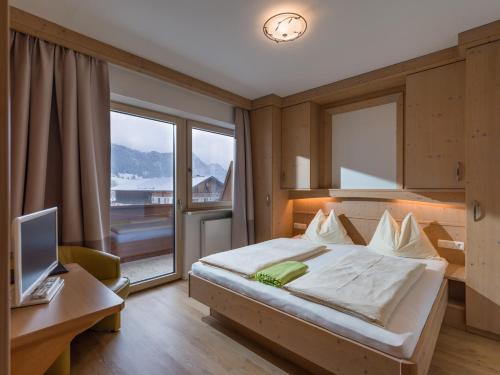 Postel nebo postele na pokoji v ubytování Aparthotel Brandauerhof