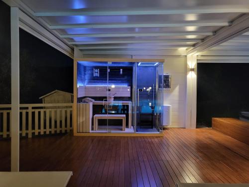 a room with a large glass door on a balcony at Villa Ca' Viola Rimini in Rimini