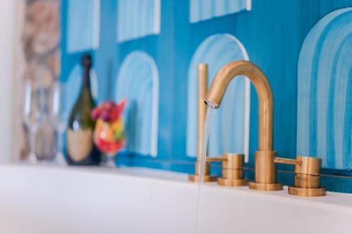 a sink with a faucet in a bathroom at Grand Hotel Le Rocce in Gaeta