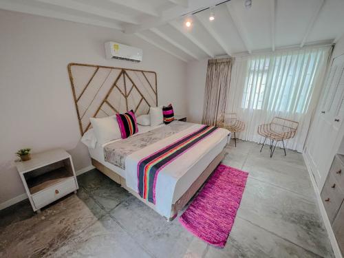 En eller flere senge i et værelse på MARAYA CAMPESTRE