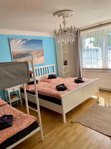 a bedroom with a bunk bed and a chandelier at Ubytování U Mikeša in Břeclav