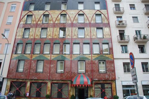 an old building on the corner of a street at Hotel Auriga in Milan