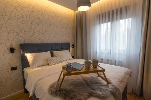 Postel nebo postele na pokoji v ubytování Apartman Čari na Tari