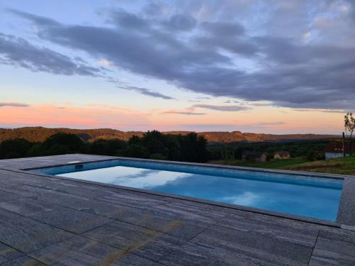 a swimming pool on the roof of a house at Liebe zur Steiermark / Haus Tyrol in Jagerberg