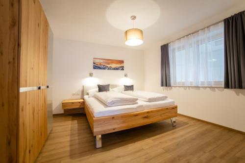 Giường trong phòng chung tại Apart Heimatliebe