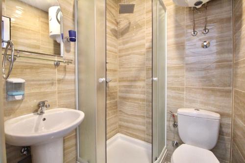 a small bathroom with a toilet and a sink at Apartment ANA in Bar