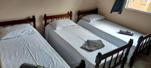 Ліжко або ліжка в номері Pousada Bela Rainha