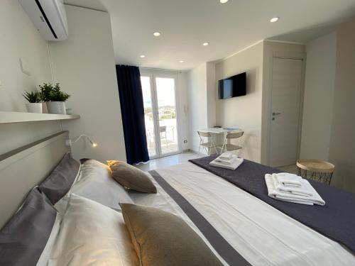 A bed or beds in a room at Stupenda Mansarda vista Mare