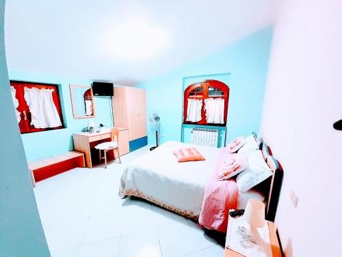 Ένα ή περισσότερα κρεβάτια σε δωμάτιο στο Hotel affittacamere novella