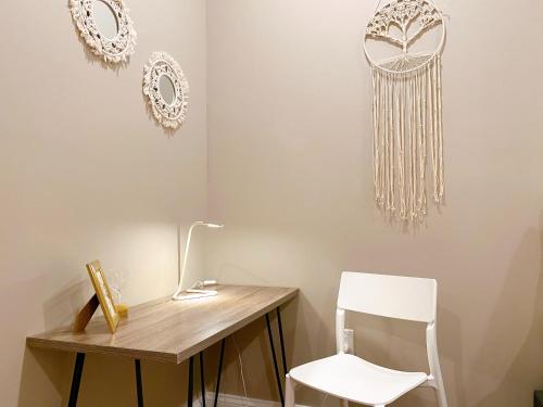 a room with a wooden desk and a white chair at Stay at Luna on Callowhill in Philadelphia