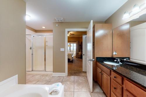 a bathroom with a sink and a shower in a room at Phoenix West II #1916 in Orange Beach